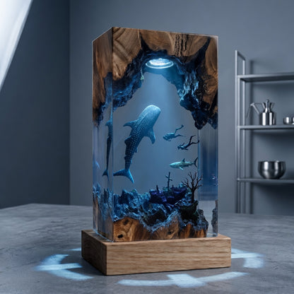 Handmade whale shark resin lamp with ocean cave scene, natural wood base and blue ambient LED lighting.